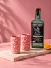 Mezcal Montelobos con vasitos de talavera rosa